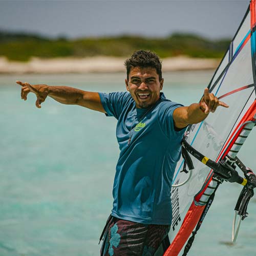 Male standing on kite surfing board