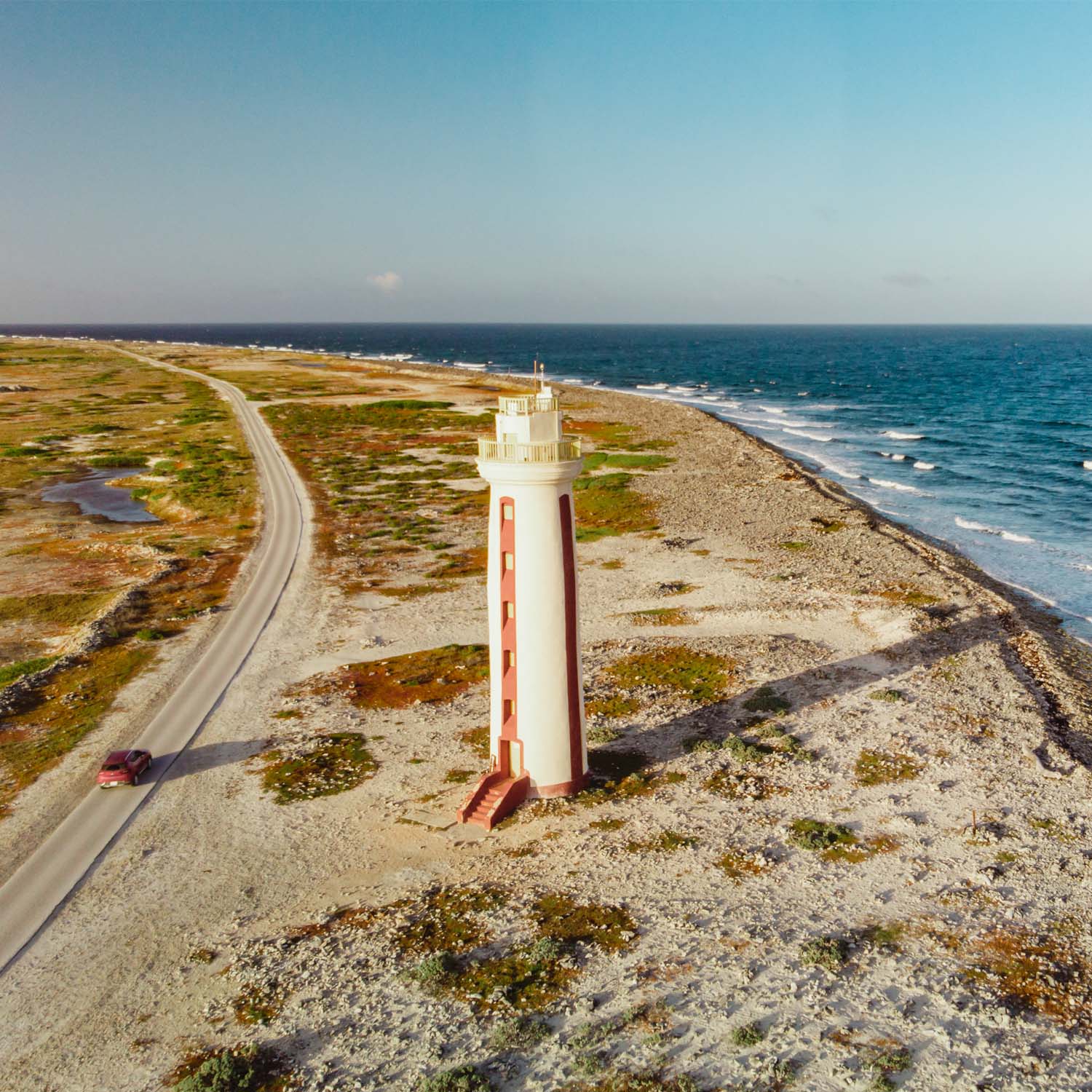 Aerial view of lighthouse on island coast