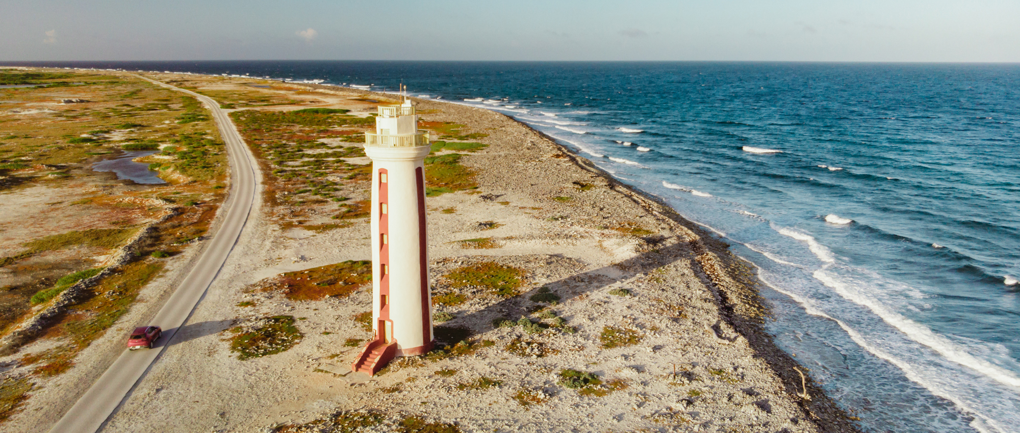 Aerial image of lighthouse on island coast