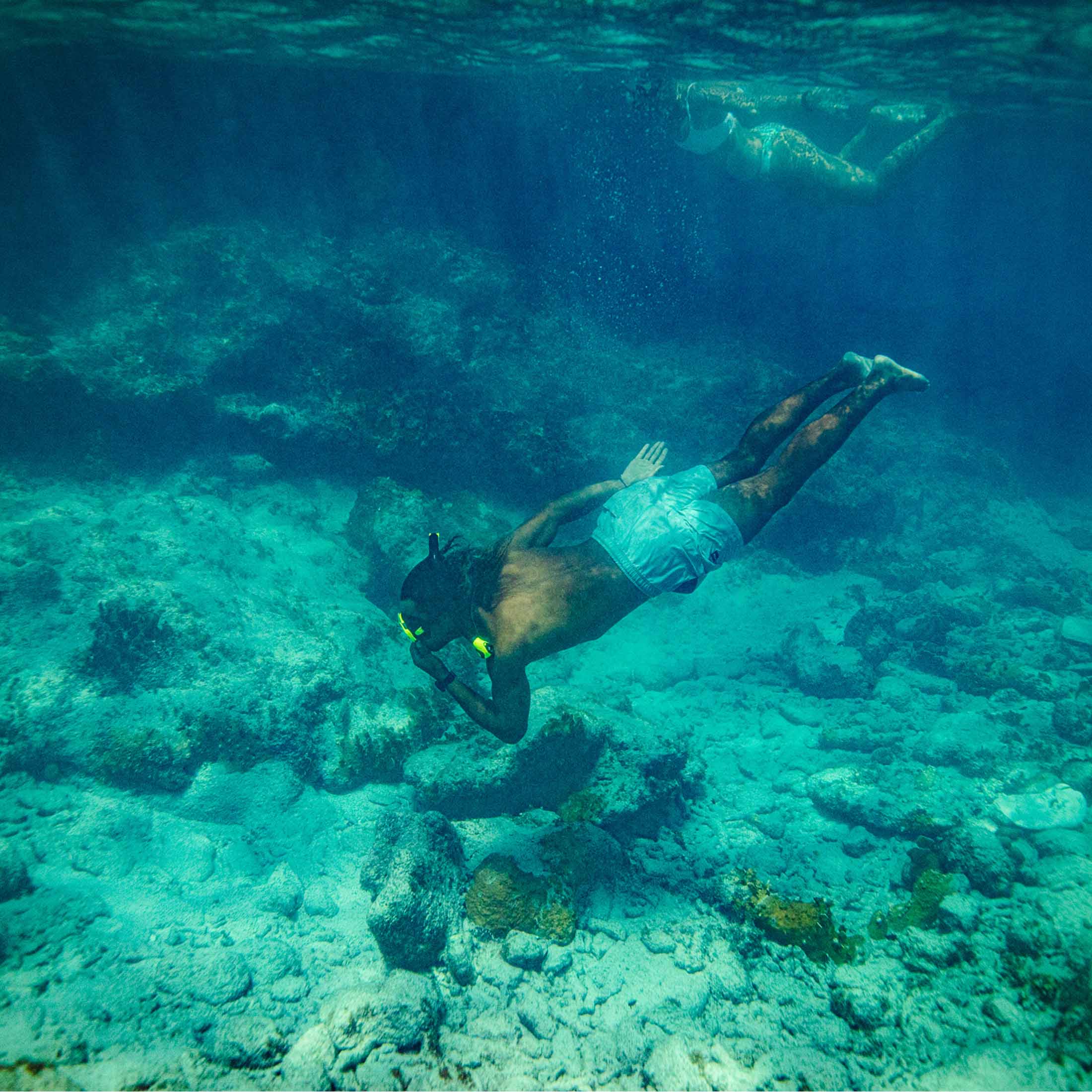 Male swimming underwater