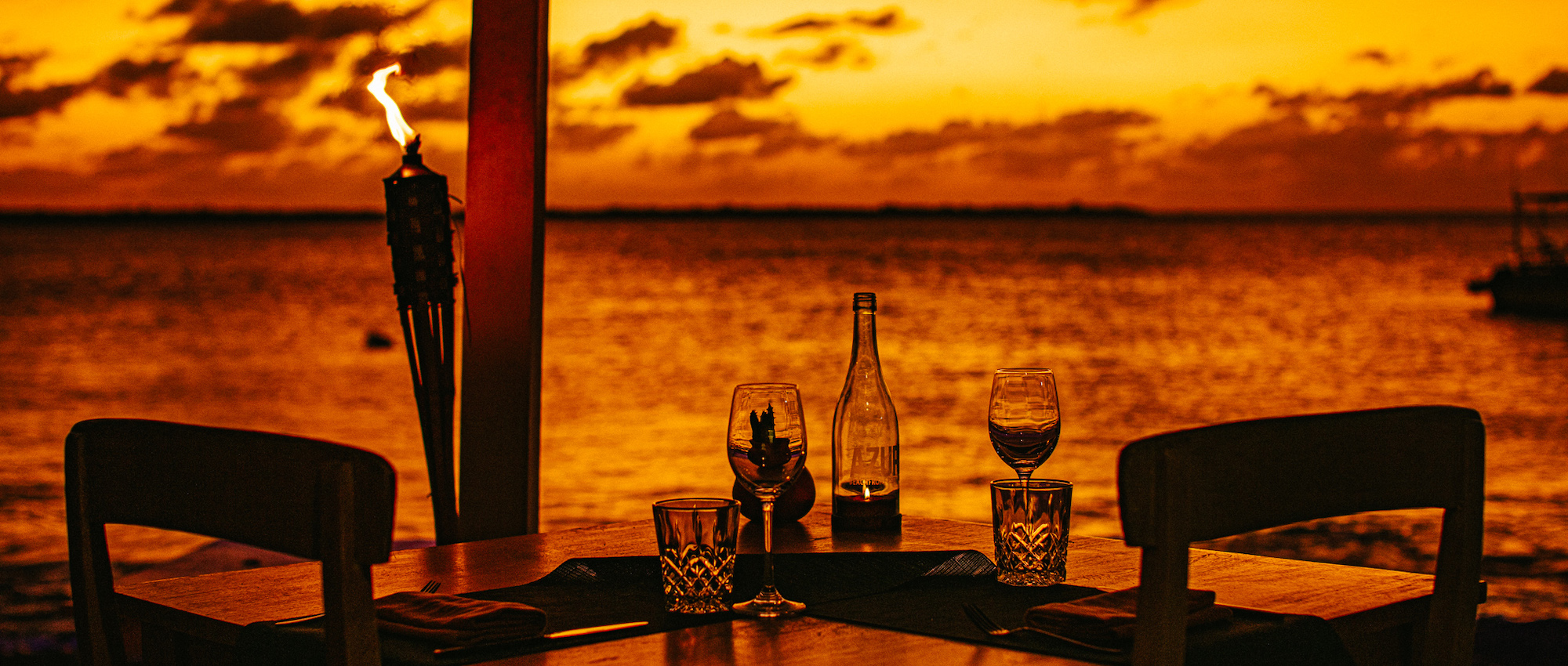 Table setting with wine at sunset