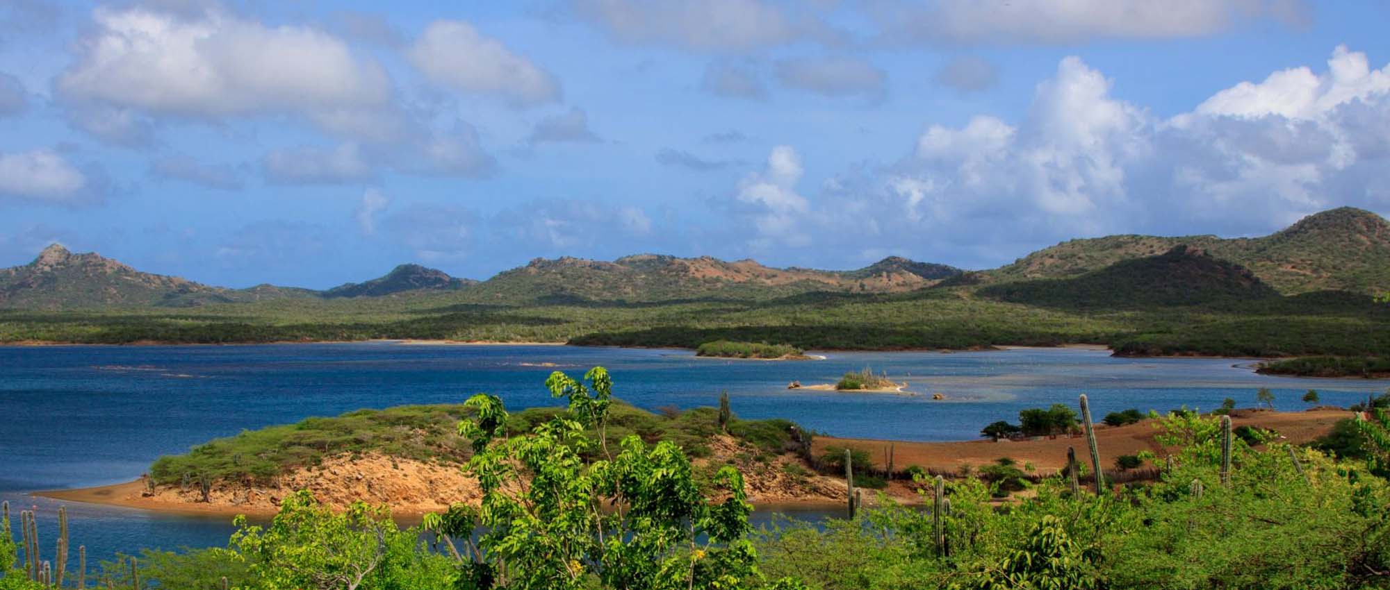 Landscape view of lagoon with hills in the background