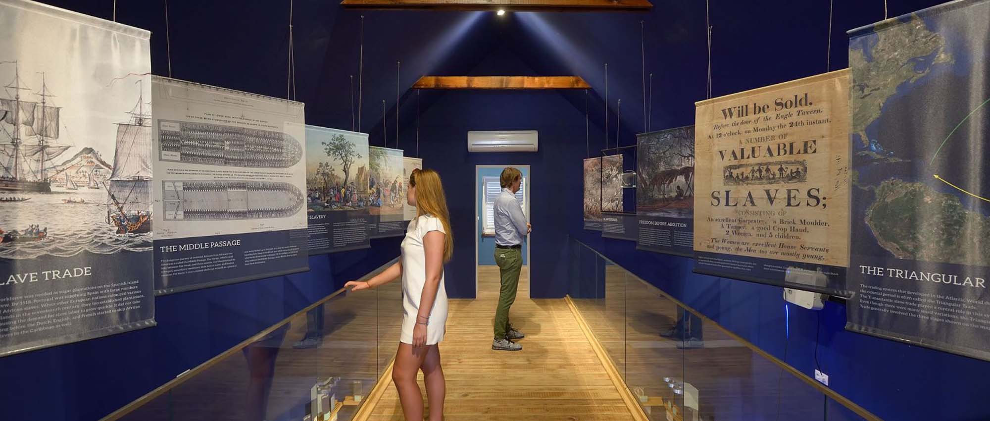 Two people exploring a museum