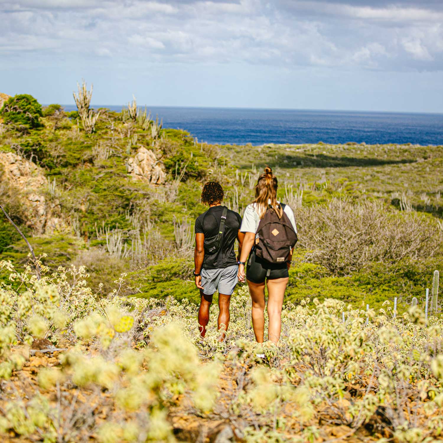 Male and female hiking on mountain