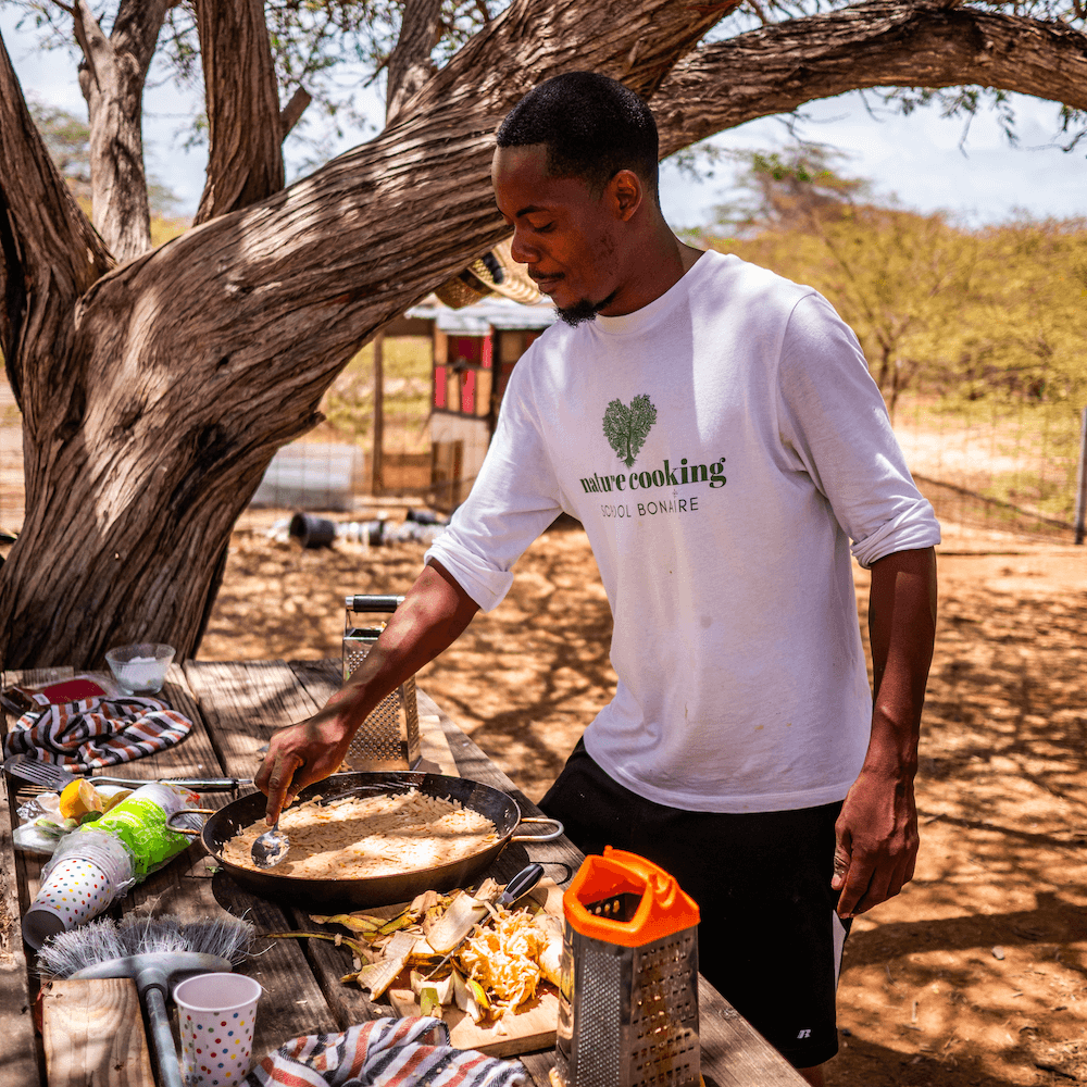 Man preparing food on picnic table