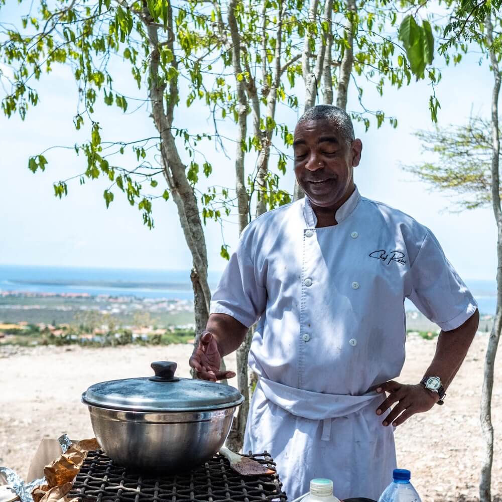 Chef preparing food beachside