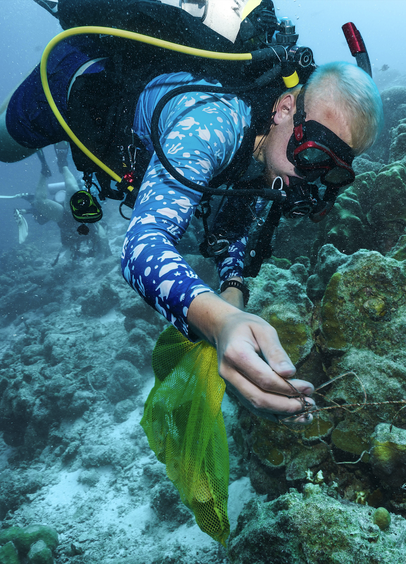 Scuba diver participating in a dive clean-up in Bonaire
