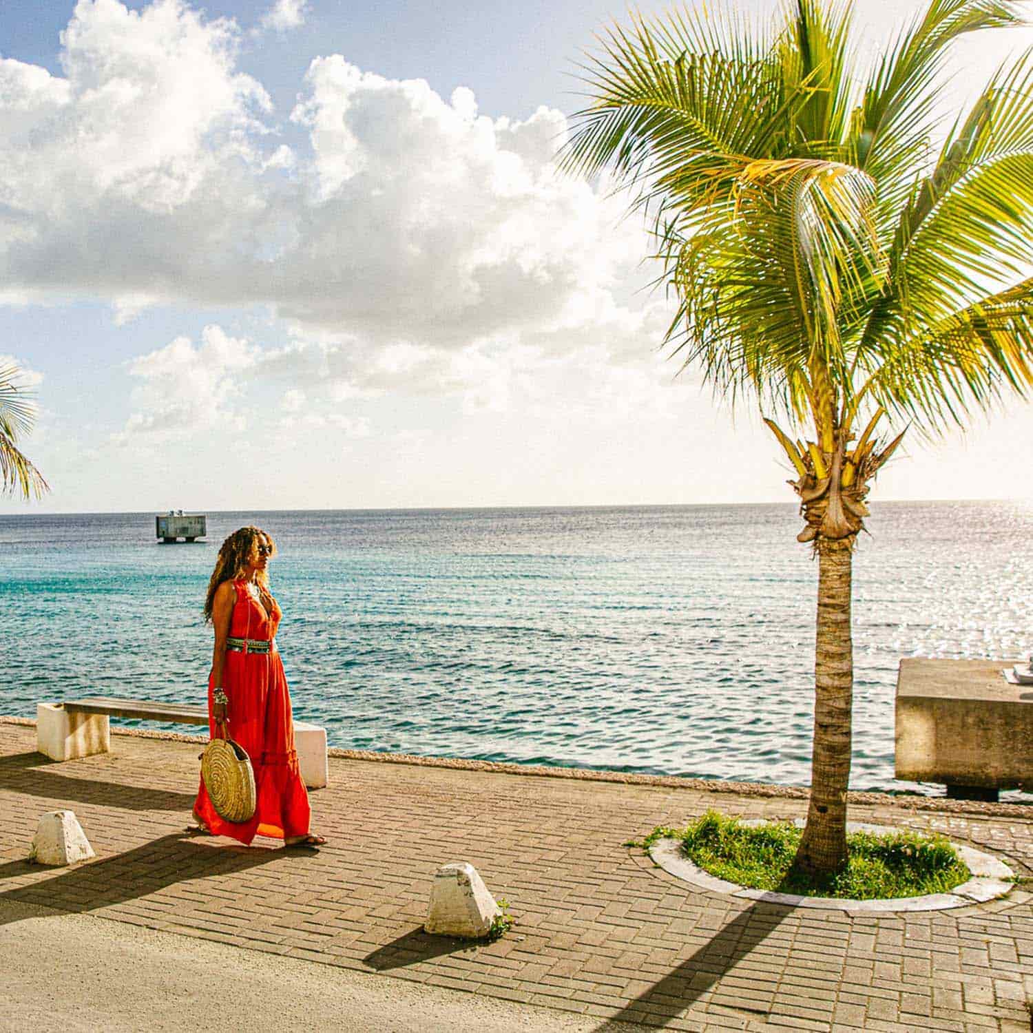 Woman walking alongside ocean view